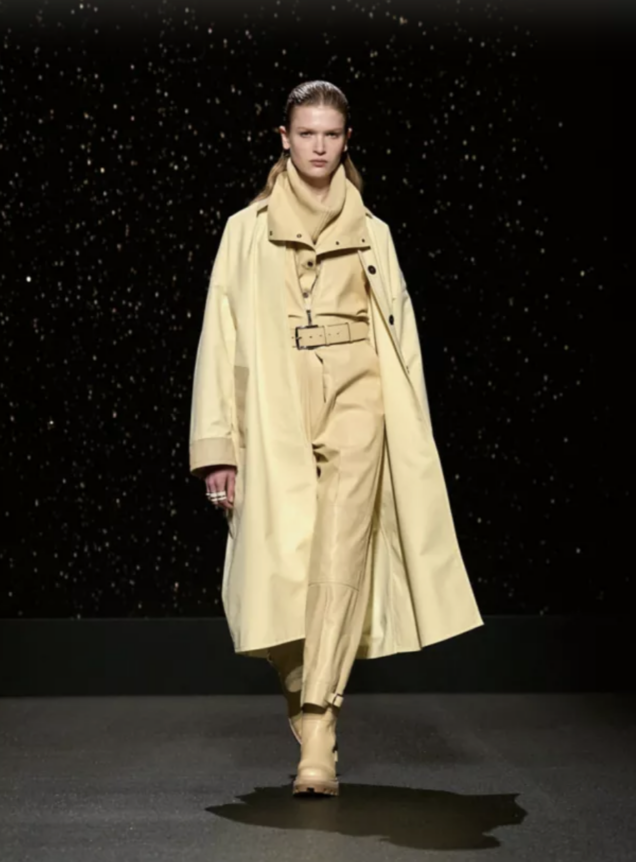 model walking down the runway at Hermès FW24 in yellow leather look